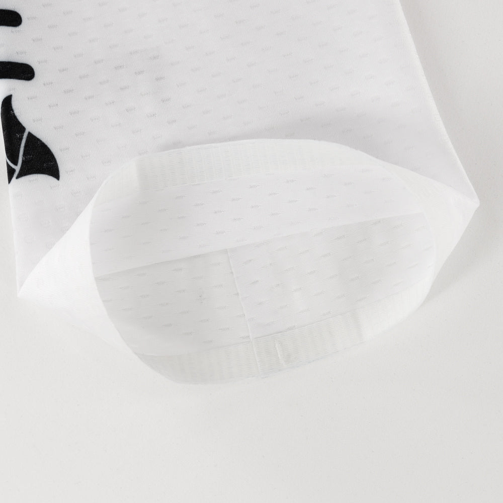 Inside view of white CORE Calf Sleeves showing fabric construction and seamless hem finish.