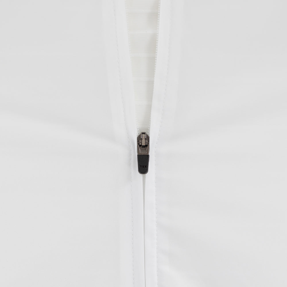 Close-up of the YKK zipper used on the front of the white/black VORTEX triathlon suit