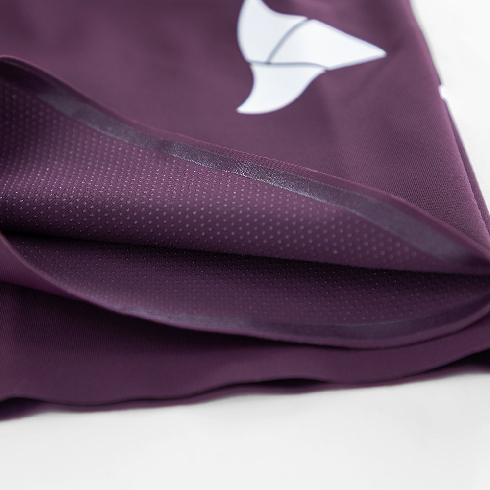 Close-up of printed silicone dot grippers on inner leg hem of VANGUARD tri-suit