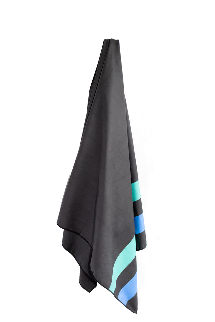 TRI-FIT transition towel hanging up in black showing tri-fit colours of aqua and blue